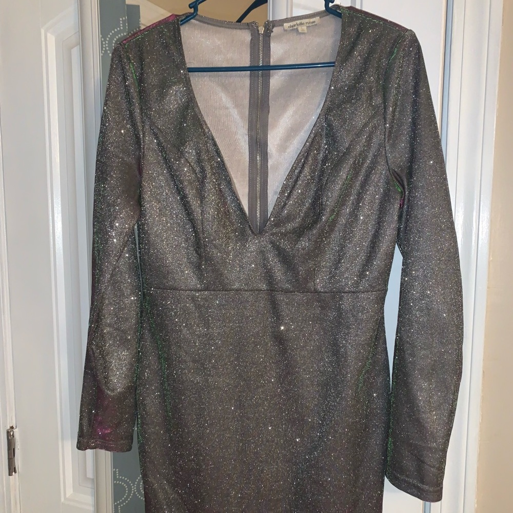 This is such a fun dress it is silver and sparkly but changes in the light